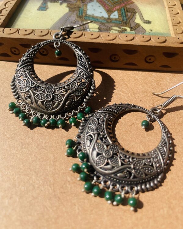 Traditional oxidised drop earrings with green moti beads