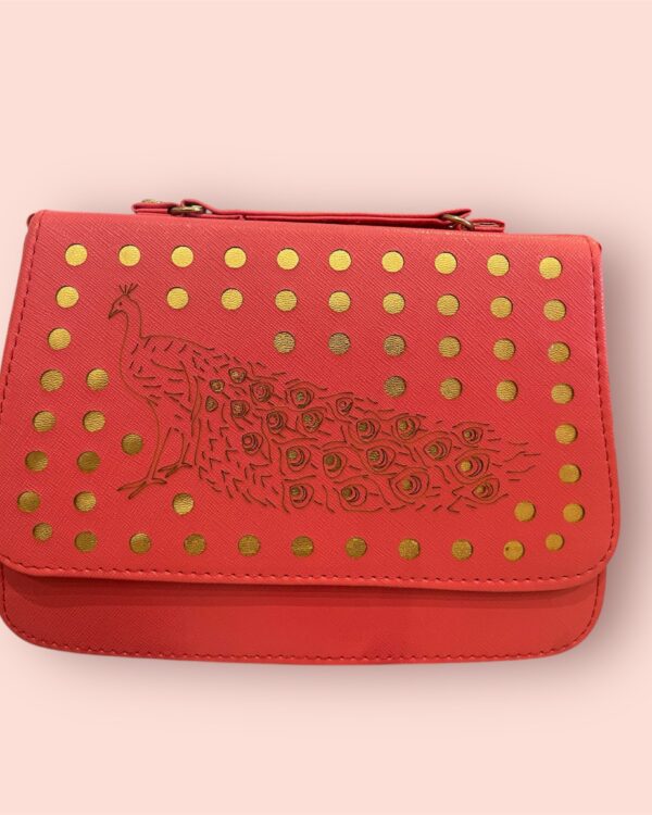 Pink gold studded purse